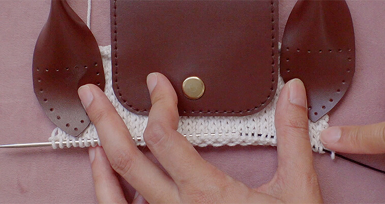 The number of cast on stitches will depend on the length of your leather flap and handles