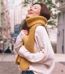 girl wearing handknit scarf