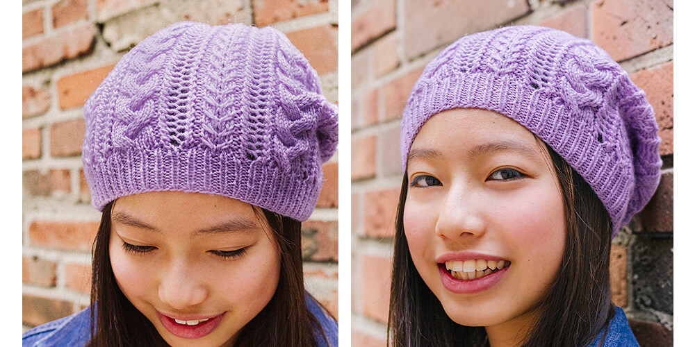 girl wearing purple knit hat with cables and lace texture