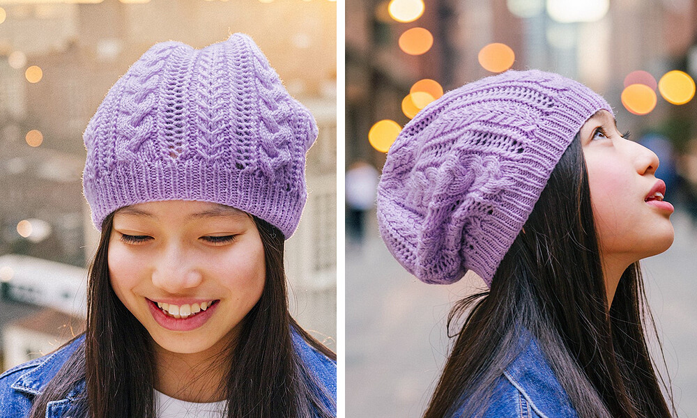 girl wearing a purple knit hat that has cables and lace texture